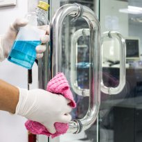 Prevention cleaning Door handles by Disinfectant solution for ki Prevention cleaning Door handles by Disinfectant solution for killing corona virus on touching surfaces, concept coronavirus COVID19